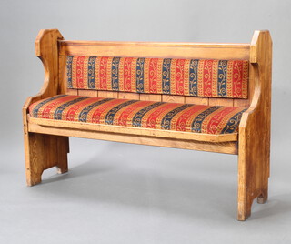 A Victorian style pine settle with upholstered seat and back 97cm h x 145cm w x 49cm d 