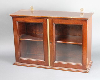 A 19th Century mahogany hanging display cabinet, fitted shelves enclosed by glazed panelled door 36cm h x 53cm w x 18cm d 