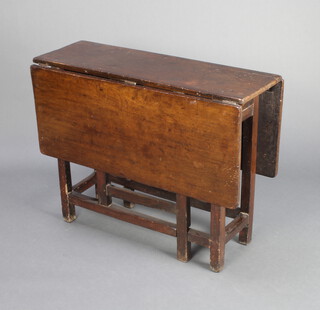 An 18th oak drop flap gateleg tea table fitted a frieze drawer, raised on square supports 70cm h x 91cm w x 30cm l when closed x 105cm when open 