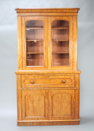 A Victorian bleached mahogany secretaire bookcase with moulded cornice, fitted shelves enclosed by arched panelled doors, base fitted a secretaire drawer above a cupboard enclosed by pair of arched panelled doors 217cm h x 121cm w x 49cm d 