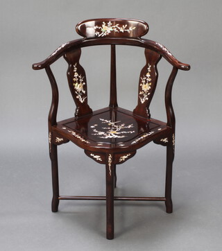 A Chinese hardwood and inlaid mother of pearl slat back corner chair, raised on turned supports with X framed stretcher 