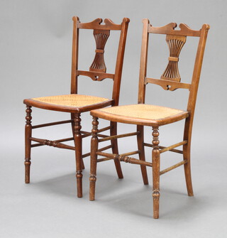 A pair of Victorian walnut bar back bedroom chairs with pierced vase shaped slat backs, woven cane seats 
