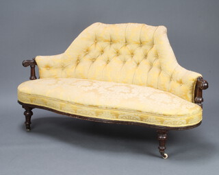 A Victorian metal and mahogany show frame sofa upholstered in yellow buttoned material raised on turned supports 76cm h x 155cm w x 63cm d 
