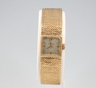 A lady's 9ct yellow gold Omega wristwatch and bracelet 28.7 grams 
