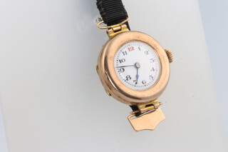 A lady's 9ct yellow gold wristwatch with red 12