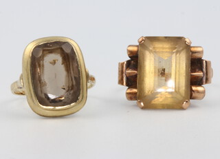 A 9ct yellow gold smoky quartz ring size G, an Art Deco style ditto size M 1/2, 6.9 grams 