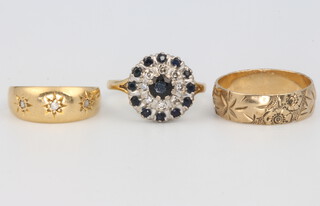 A 9ct yellow gold wedding band 3.1 grams, size N, a high carat yellow gold diamond ring 3.2 grams size K and a 9ct yellow gold sapphire and diamond cluster ring 4.2 grams, size M 1/2 
