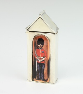 A modern sterling silver and enamelled vesta in the form of a guardsman in a sentry box 41 grams, 5.5cm 