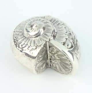 A modern repousse Sterling silver pill box in the form of a shell, 4cm, 21 grams