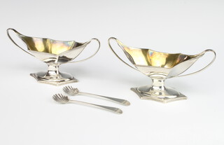 A pair of William IV hexagonal boat shaped table salts with gilt interiors, London 1791, maker Robert Hennell, 186 grams together with 2 later spoons 