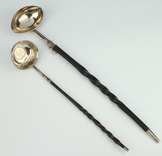 A Georgian silver punch ladle with coin set base and whalebone handle, a plain ditto 
