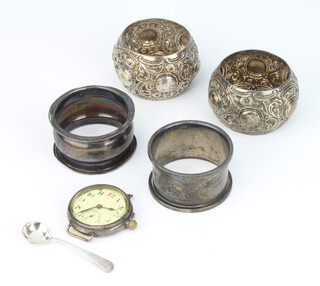 A silver napkin ring London 1914, 3 others, a spoon and wristwatch, weighable silver 84 grams 