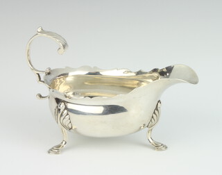 A George II silver sauce boat with S scroll handle on pad feet London 1758, 140 grams