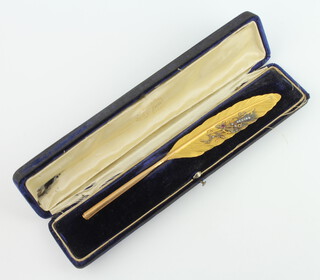 A 19th Century French Palais Royale gold, diamond and ruby set pen in the form of a feather 13.5 grams, 20cm and contained in original fitted case