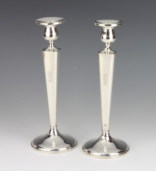 A pair of Sterling silver tapered candlesticks with engraved monogram 25cm 