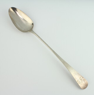 A George III silver gravy spoon with engraved monogram, London 1802, 93 grams 