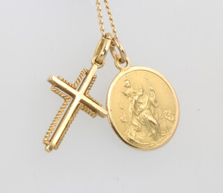 A 9ct yellow gold St Christopher pendant, and a cross hung on a chain, 6 grams 
