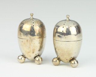 A pair of Edwardian silver ovoid condiments Birmingham 1907, 6.5cm, 66 grams