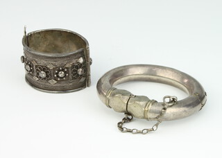 An African silver bangle, a wire work ditto, 252 grams