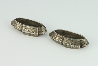 A pair of Persian silver floral engraved oval lozenges 6cm, 134 grams
