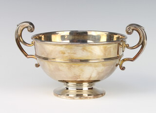 A silver 2 handled presentation trophy with fancy scroll handles 27cm, 494 grams 