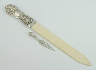 An Edwardian silver bookmark in the form of a trowel Birmingham 1901 and a silver mounted page turner 