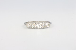 A platinum 5 stone diamond ring, approx. 0.75ct, size N 