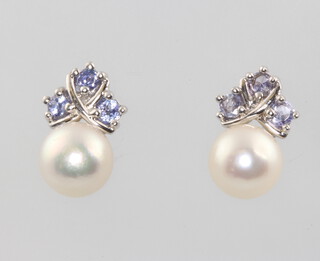 A pair of 9ct white gold pearl and tanzanite ear studs 2.9 grams