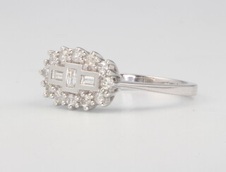 An 18ct white gold baguette and brilliant cut diamond cluster ring size M 1/2, 0.5ct 