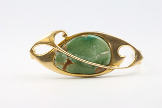 A 15ct yellow gold and jade brooch, a tiger's eye brooch 