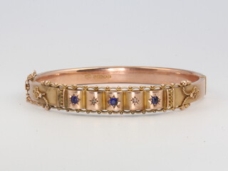 A Victorian 9ct yellow gold amethyst and diamond etruscan style bangle, 11 grams