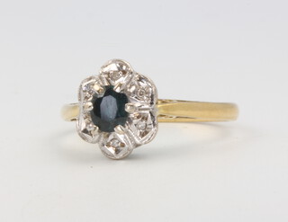 An 18ct yellow gold sapphire and diamond cluster ring size N 1/2 