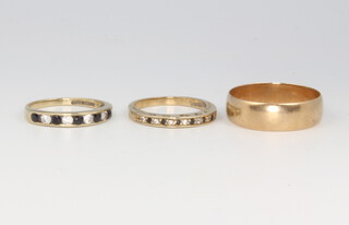 A 9ct yellow gold wedding band, size W, 3.9 grams and 2 9ct gold gem set rings sizes N and P 4.6 grams 