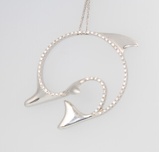 An 18ct white gold and diamond dolphin pendant and chain 16.1 grams 