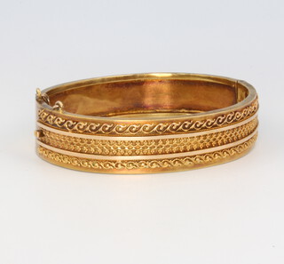 A 15ct yellow gold etruscan style bangle 16.9 grams 