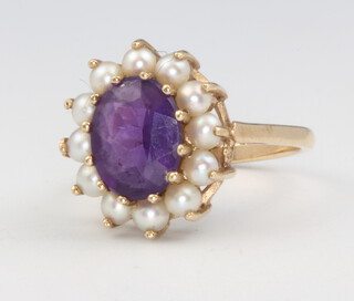 A 9ct yellow gold amethyst and seed pearl ring size N, 3.9 grams 