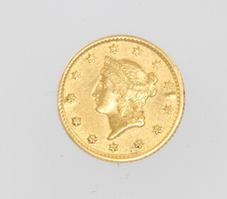 An 1853 1 dollar coin 1.6 grams 