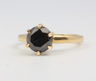 An 18ct yellow gold onyx ring size M, 3.7 grams 