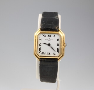 A lady's 18ct yellow gold octagonal cased Baume and Mercier wristwatch with cabochon cut sapphire winder 