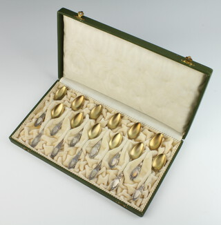 A cased set of twelve 800 standard silver coffee spoons with gilt bowls 96.5 grams