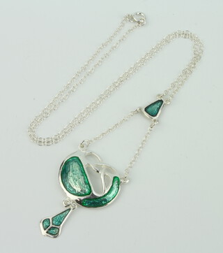 An Art Nouveau style silver and enamelled open pendant and chain 