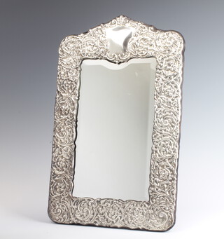 A Victorian style repousse silver photograph frame decorated with scrolling flowers Sheffield 1991 43cm x 27cm 