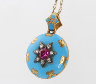 A Victorian gilt enamel and paste set pendant on a gold chain 
