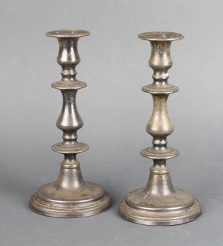 A pair of silver plated waisted candlesticks 23cm 
