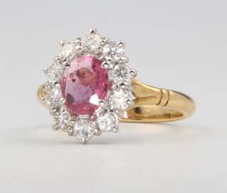 An 18ct yellow gold oval ruby and diamond cluster ring, centre stone approx. 1.5ct, diamonds 1ct, size N 