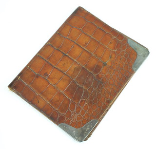 An Edwardian silver mounted crocodile binder