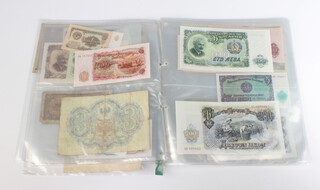 A folder of world bank notes 