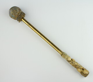 A Victorian gong beater with carved bone handle