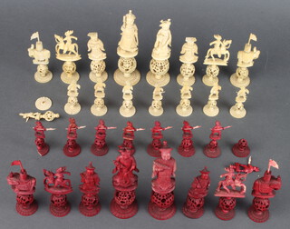 A carved Cantonese and stained ivory chess set, the King 13cm, bases with carved concentric balls  