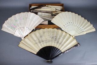 A carved Cantonese ivory fans, a collection of bone, ivory and mother of pearl lacquer fans 